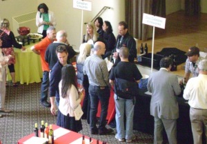 (From left to right) Arizona wineries Callaghan Vineyards and Dos Cabezas WineWorks pour to curious TAPAS-goers. (Photo by Cynthia Bournellis)